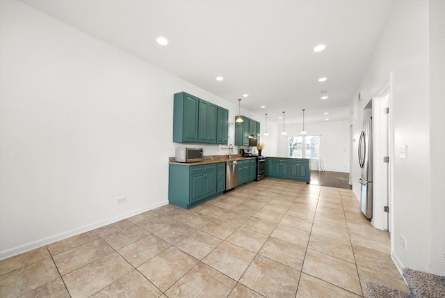 kitchen featuring sink, light tile patterned floors, stainless steel appliances, and hanging light fixtures