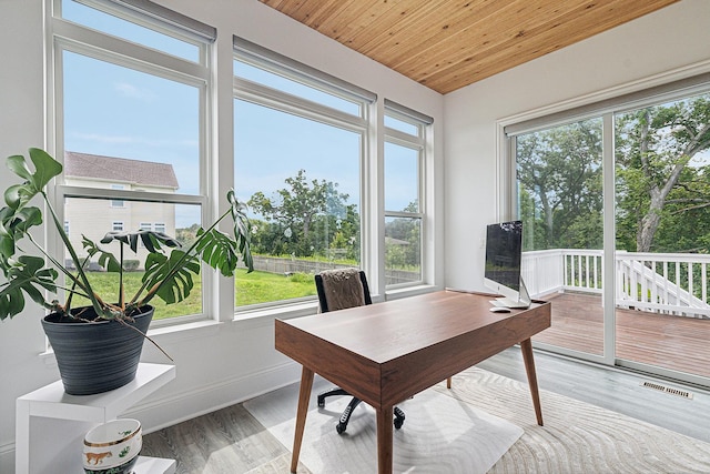 office with light hardwood / wood-style floors and wood ceiling