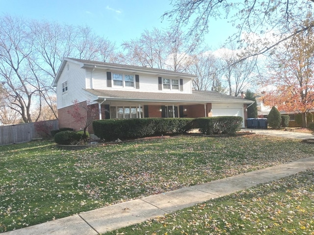 view of front property with a front yard and a garage