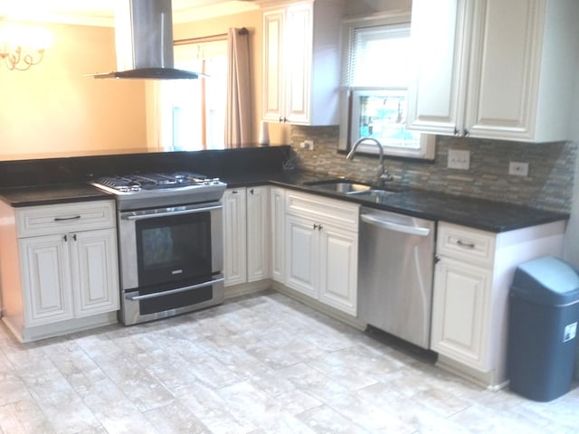 kitchen featuring white cabinetry, extractor fan, and appliances with stainless steel finishes