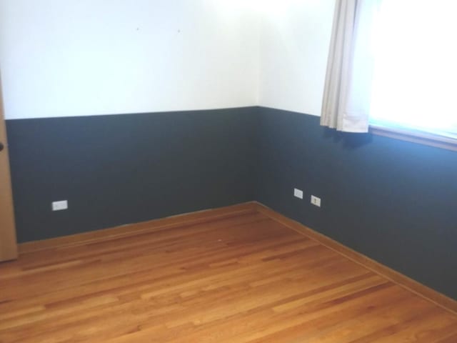 empty room featuring wood-type flooring