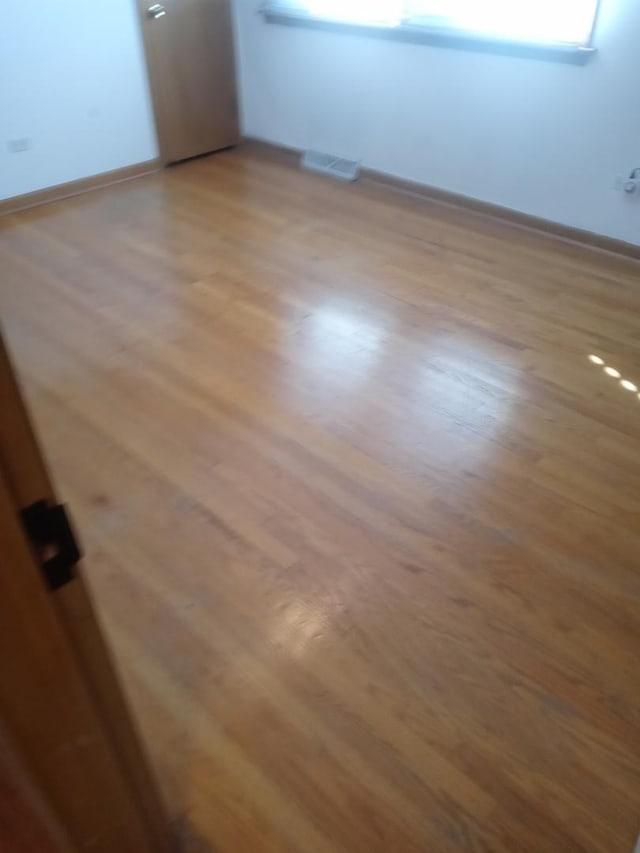 interior details featuring hardwood / wood-style flooring