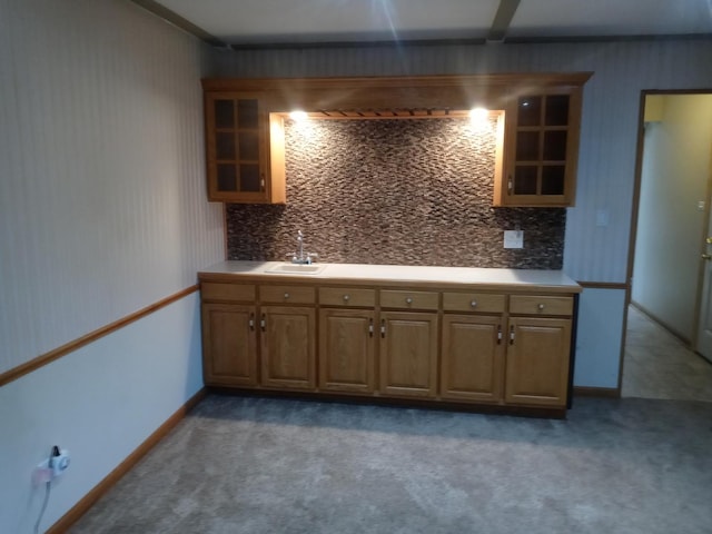 kitchen featuring sink and dark carpet