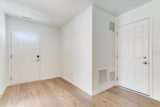 foyer featuring visible vents and light wood finished floors