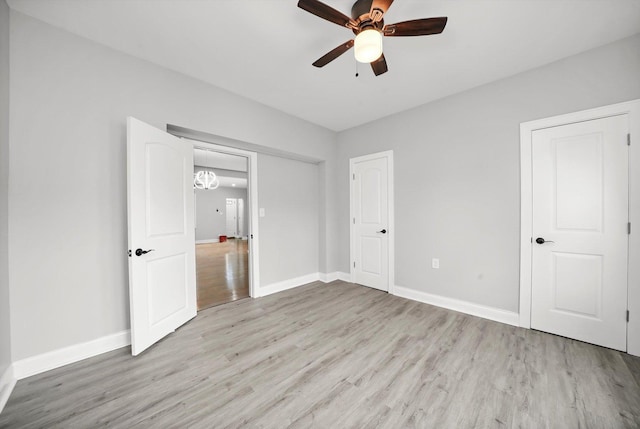 unfurnished bedroom featuring ceiling fan and light hardwood / wood-style floors