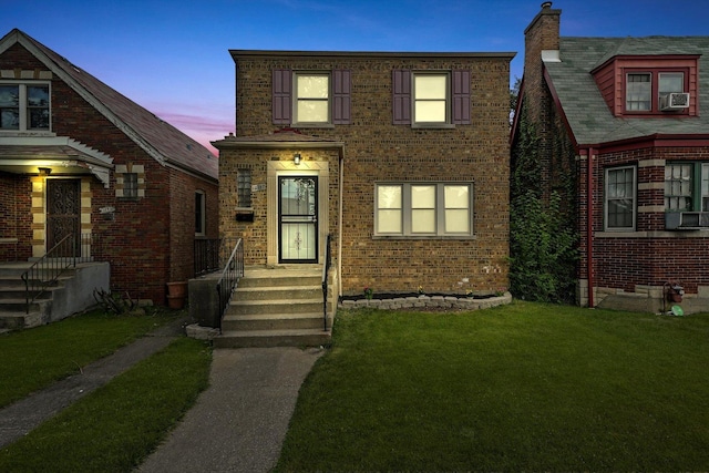 view of front of home with a yard