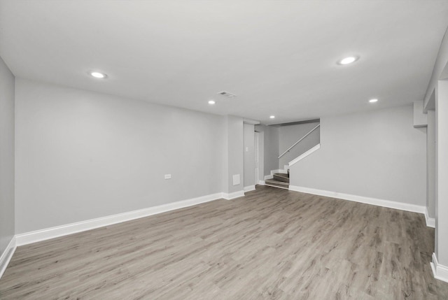 basement featuring light hardwood / wood-style flooring