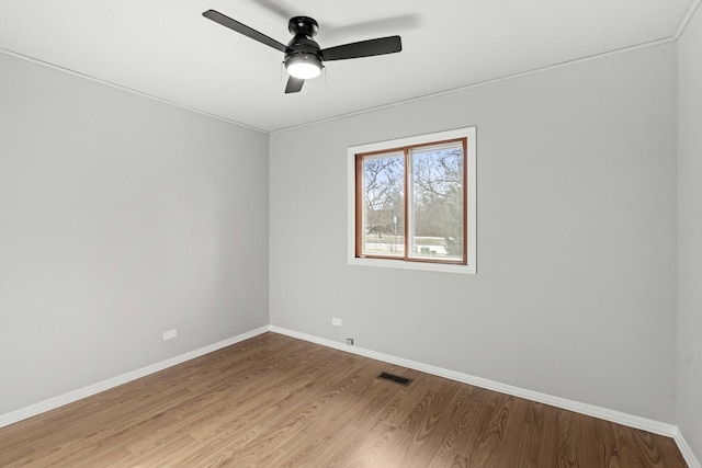 spare room with light hardwood / wood-style flooring and ceiling fan