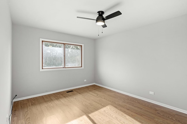 spare room with ceiling fan and light hardwood / wood-style floors