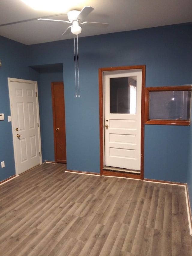 spare room with ceiling fan and hardwood / wood-style floors