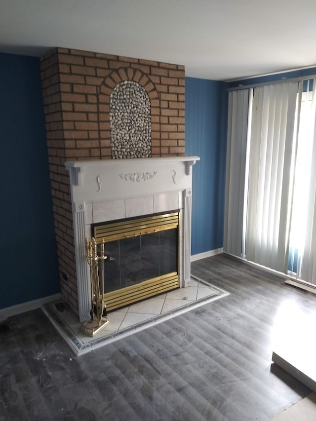 room details with a fireplace and hardwood / wood-style flooring