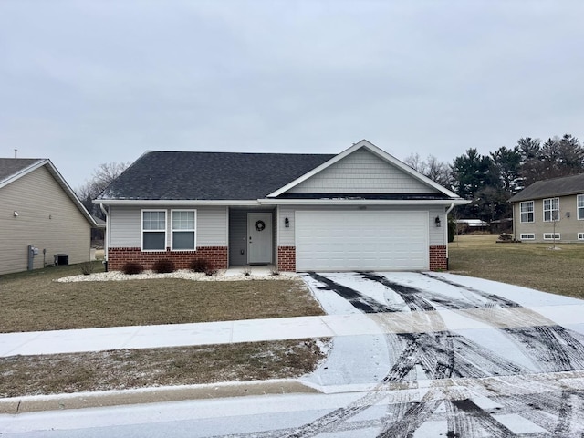 ranch-style home with a garage and a front lawn