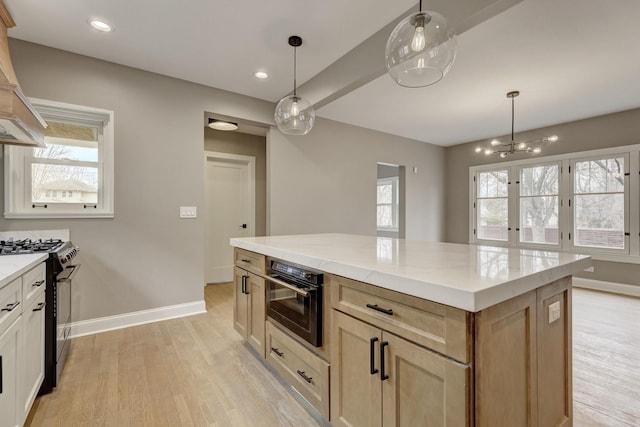 kitchen with light wood-style flooring, oven, premium range hood, baseboards, and stainless steel gas range