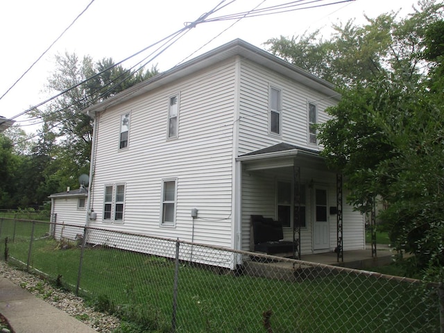 view of property exterior featuring a lawn