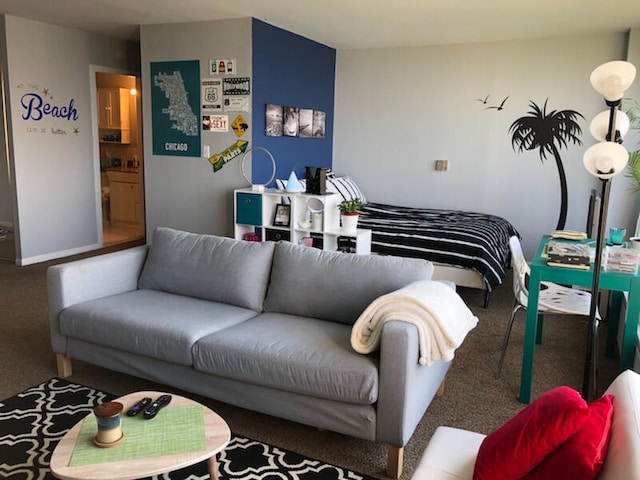 bedroom featuring carpet flooring and connected bathroom