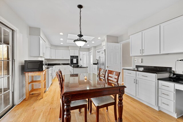 dining space featuring light hardwood / wood-style floors