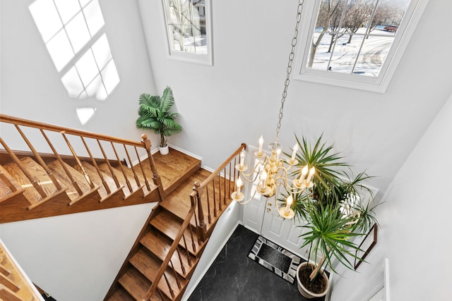 stairway with an inviting chandelier