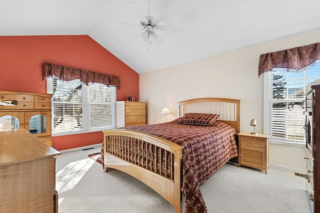 carpeted bedroom featuring ceiling fan, lofted ceiling, and multiple windows