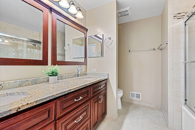 full bathroom with vanity, tile patterned floors, shower / bath combination with glass door, and toilet