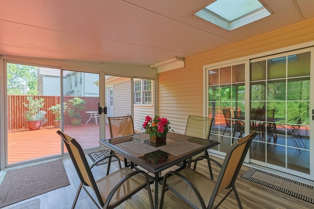 sunroom featuring a skylight