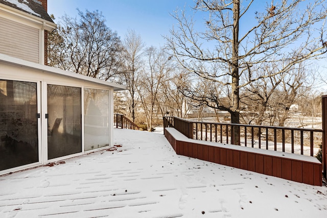 view of snow covered deck