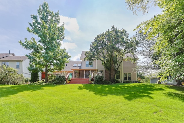 view of yard with a sunroom