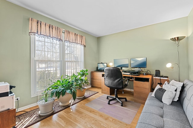 office with light hardwood / wood-style floors