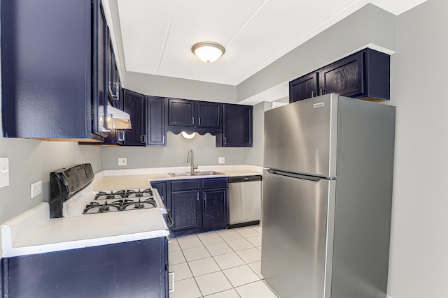 kitchen with appliances with stainless steel finishes, light tile patterned floors, and sink