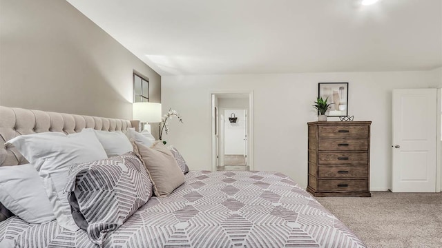 bedroom featuring light carpet