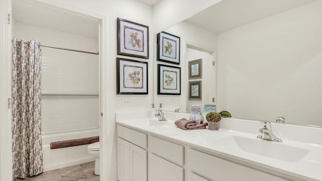 full bathroom featuring toilet, vanity, tile patterned floors, and shower / bathtub combination with curtain