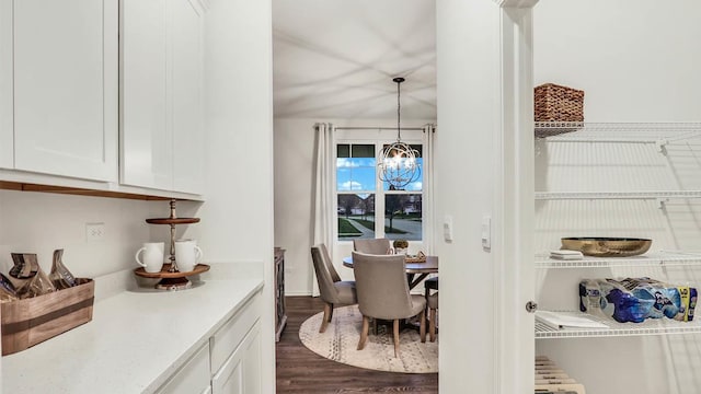 dining room featuring a chandelier and dark hardwood / wood-style flooring