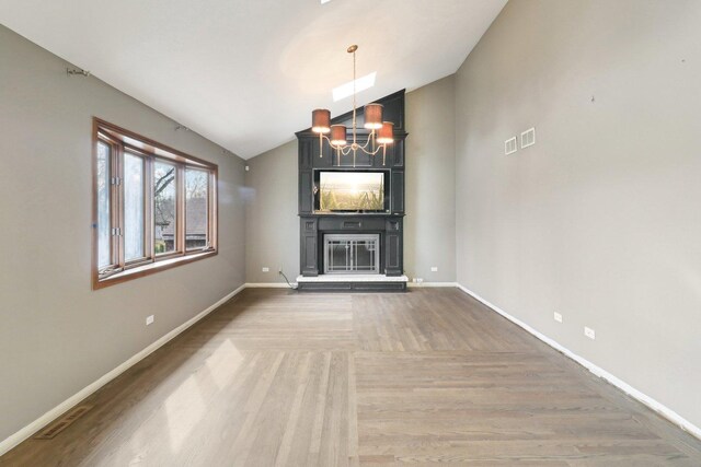 bedroom featuring dark wood-style floors, a chandelier, and high vaulted ceiling