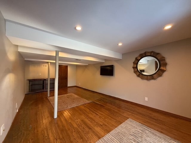 finished basement with wood finished floors and recessed lighting