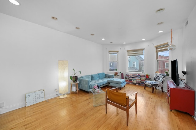 living room with light hardwood / wood-style flooring