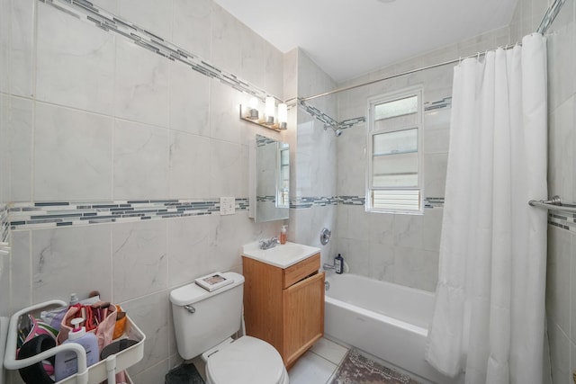 full bathroom with vanity, tile patterned flooring, toilet, tile walls, and shower / tub combo with curtain