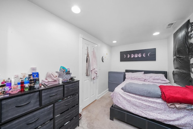 bedroom featuring light carpet