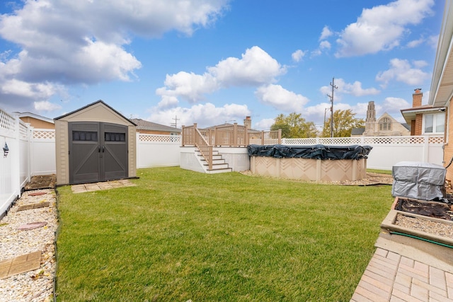 view of yard featuring a pool side deck and a shed