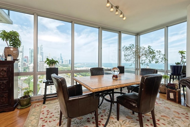 sunroom / solarium with a water view