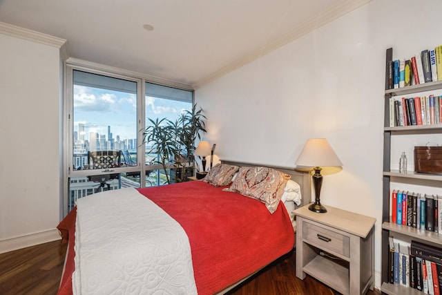 bedroom featuring floor to ceiling windows, crown molding, and dark wood-type flooring