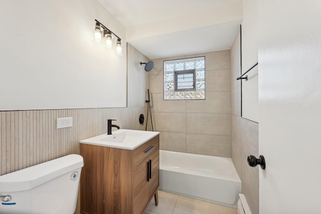 full bathroom featuring a baseboard radiator, tile patterned floors, toilet, vanity, and tiled shower / bath