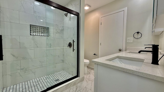 bathroom with toilet, an enclosed shower, and vanity