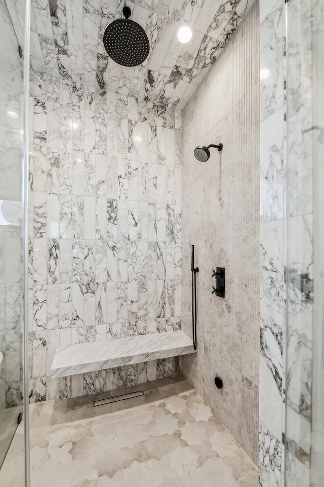 bathroom with tiled shower