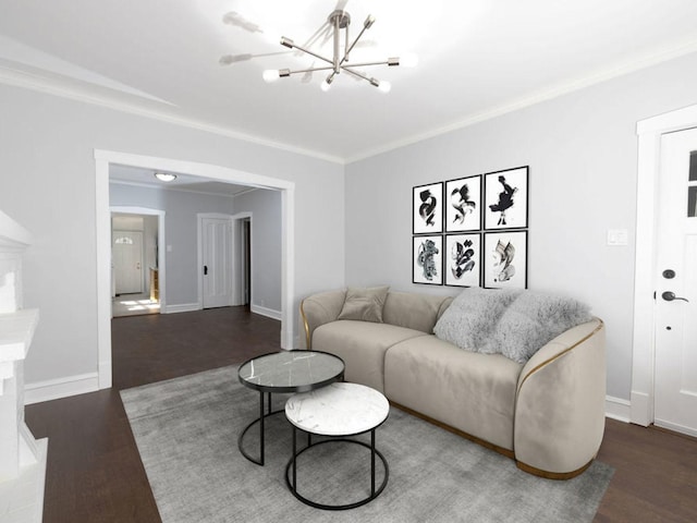 living room with ornamental molding, dark wood-type flooring, and a notable chandelier