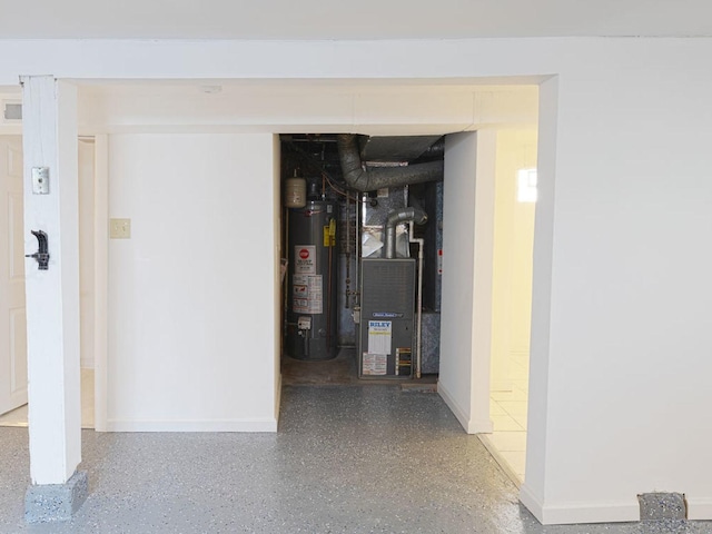 interior space featuring heating unit and water heater