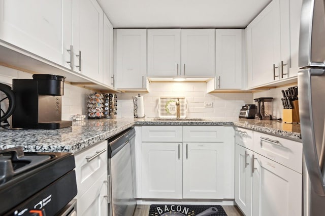 kitchen featuring white cabinetry and tasteful backsplash