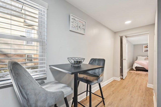 dining area with light hardwood / wood-style floors