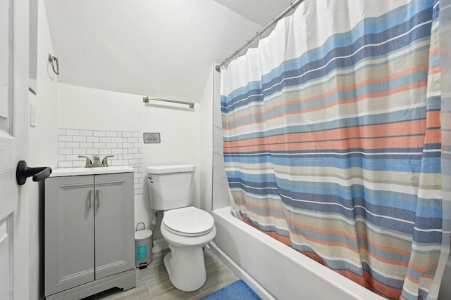 full bathroom with toilet, shower / tub combo, decorative backsplash, and vanity