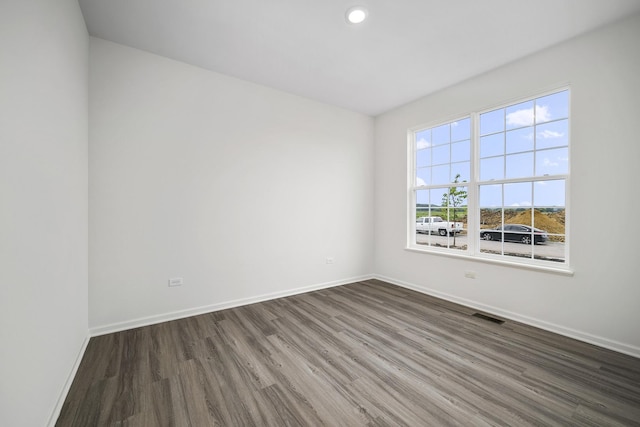 empty room featuring dark wood-type flooring