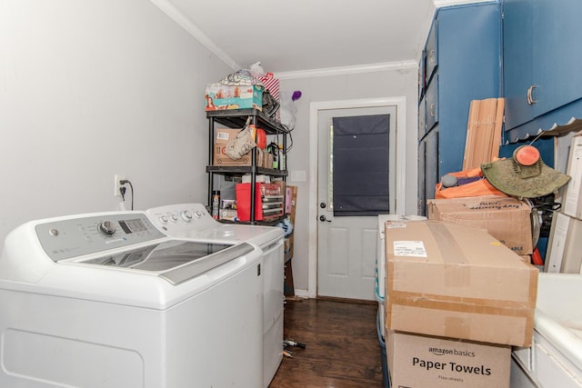 clothes washing area featuring crown molding, dark hardwood / wood-style flooring, and washer and dryer