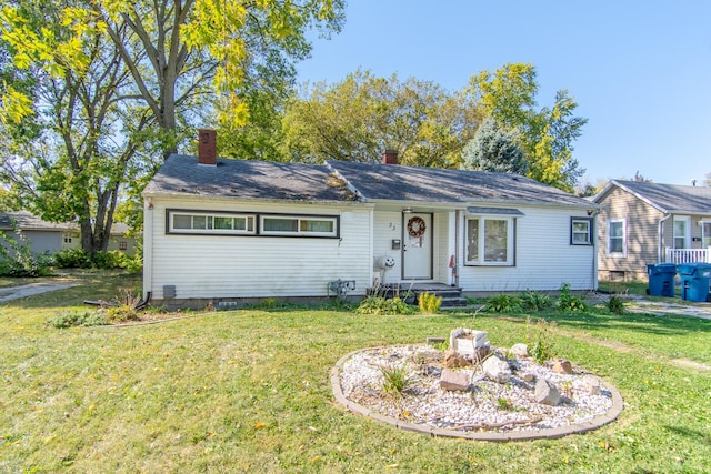 ranch-style house featuring a front lawn